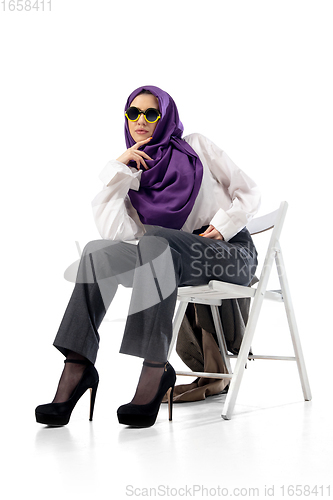 Image of Beautiful arab woman posing in stylish office attire isolated on studio background. Fashion concept