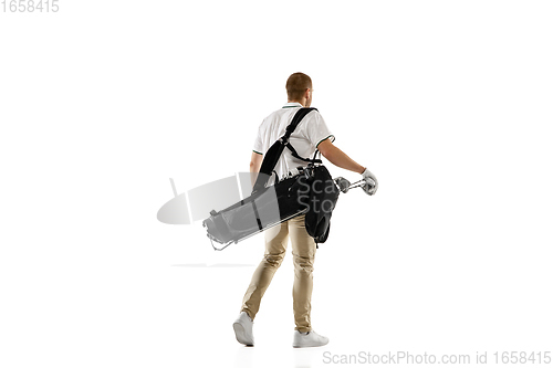 Image of Golf player in a white shirt practicing, playing isolated on white studio background