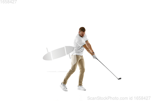 Image of Golf player in a white shirt taking a swing isolated on white studio background