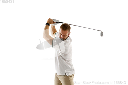 Image of Golf player in a white shirt taking a swing isolated on white studio background