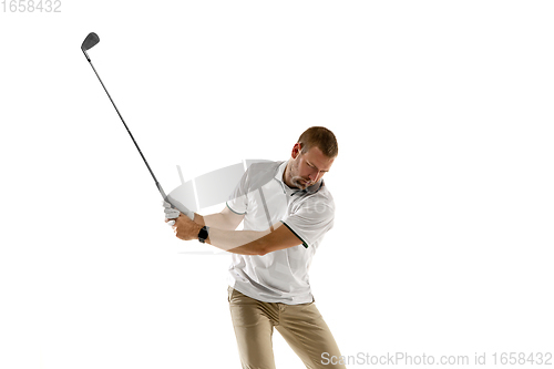 Image of Golf player in a white shirt taking a swing isolated on white studio background