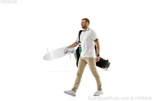 Image of Golf player in a white shirt practicing, playing isolated on white studio background