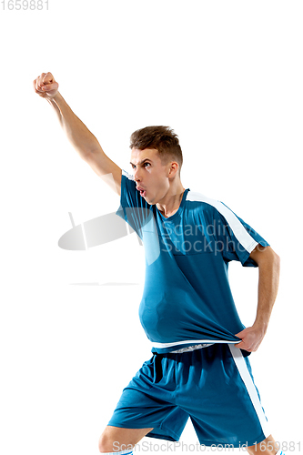 Image of Funny emotions of professional soccer player isolated on white studio background, excitement in game