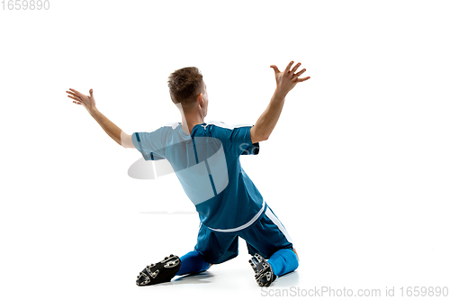 Image of Funny emotions of professional soccer player isolated on white studio background, excitement in game