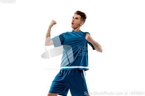 Image of Funny emotions of professional soccer player isolated on white studio background, excitement in game