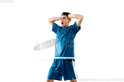 Image of Funny emotions of professional soccer player isolated on white studio background, excitement in game