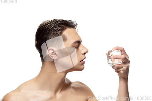 Image of Portrait of young man isolated on white studio background. Caucasian attractive male model. Concept of fashion and beauty, self-care, body and skin care.