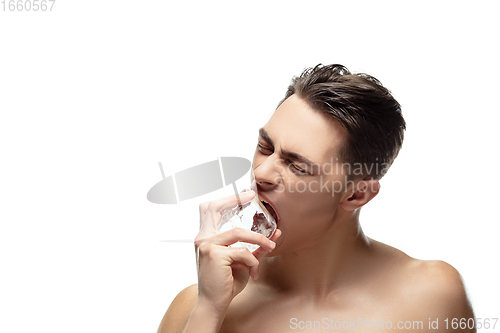 Image of Portrait of young man isolated on white studio background. Caucasian attractive male model. Concept of fashion and beauty, self-care, body and skin care.