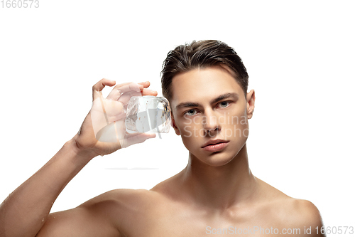 Image of Portrait of young man isolated on white studio background. Caucasian attractive male model. Concept of fashion and beauty, self-care, body and skin care.