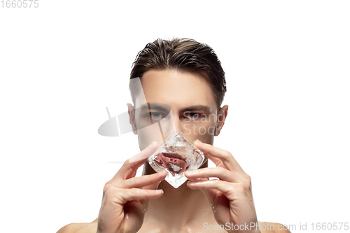 Image of Portrait of young man isolated on white studio background. Caucasian attractive male model. Concept of fashion and beauty, self-care, body and skin care.