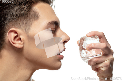 Image of Portrait of young man isolated on white studio background. Caucasian attractive male model. Concept of fashion and beauty, self-care, body and skin care.