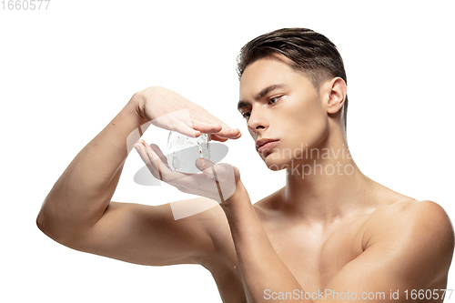 Image of Portrait of young man isolated on white studio background. Caucasian attractive male model. Concept of fashion and beauty, self-care, body and skin care.