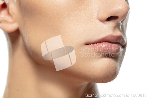 Image of Close up face of young man isolated on white studio background. Caucasian attractive male model. Concept of fashion and beauty, self-care, body and skin care.