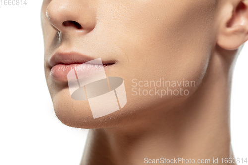 Image of Close up face of young man isolated on white studio background. Caucasian attractive male model. Concept of fashion and beauty, self-care, body and skin care.