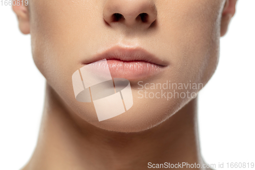 Image of Close up face of young man isolated on white studio background. Caucasian attractive male model. Concept of fashion and beauty, self-care, body and skin care.