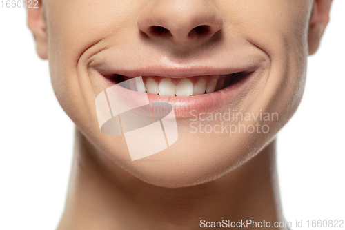 Image of Close up face of young man isolated on white studio background. Caucasian attractive male model. Concept of fashion and beauty, self-care, body and skin care.