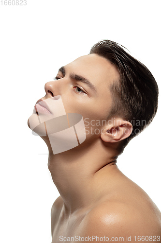 Image of Portrait of young man isolated on white studio background. Caucasian attractive male model. Concept of fashion and beauty, self-care, body and skin care.