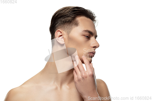 Image of Portrait of young man isolated on white studio background. Caucasian attractive male model. Concept of fashion and beauty, self-care, body and skin care.