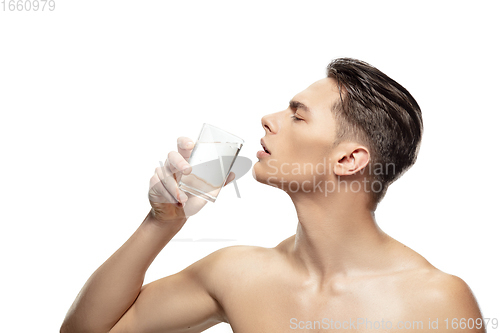 Image of Portrait of young man isolated on white studio background. Caucasian attractive male model. Concept of fashion and beauty, self-care, body and skin care.