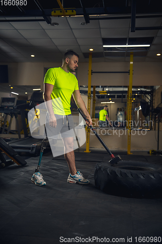 Image of Disabled man training in the gym of rehabilitation center