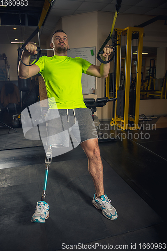 Image of Disabled man training in the gym of rehabilitation center