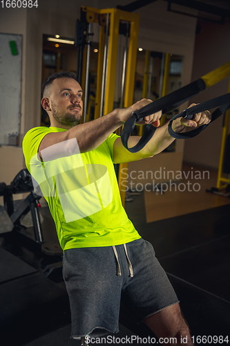 Image of Disabled man training in the gym of rehabilitation center