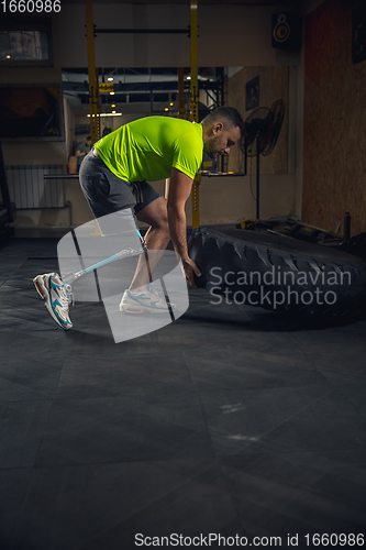 Image of Disabled man training in the gym of rehabilitation center