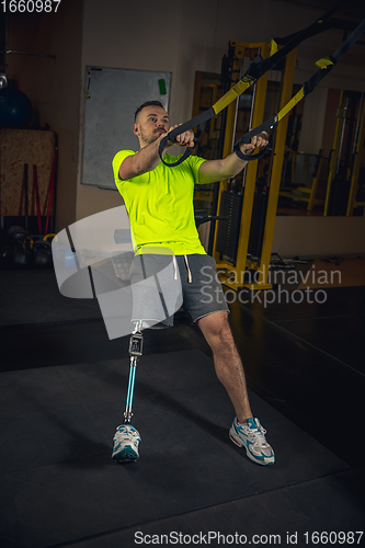 Image of Disabled man training in the gym of rehabilitation center