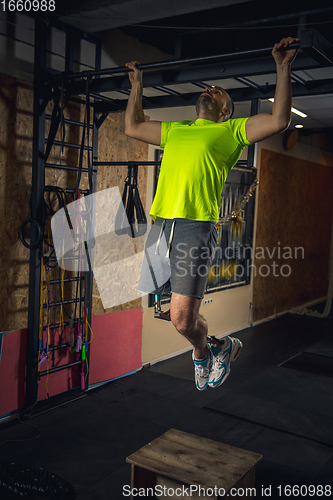 Image of Disabled man training in the gym of rehabilitation center