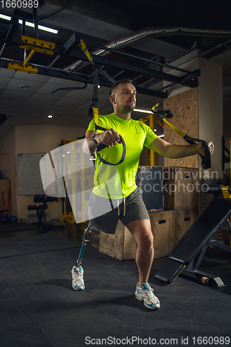 Image of Disabled man training in the gym of rehabilitation center