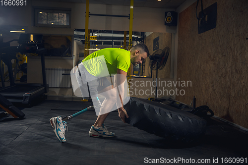 Image of Disabled man training in the gym of rehabilitation center