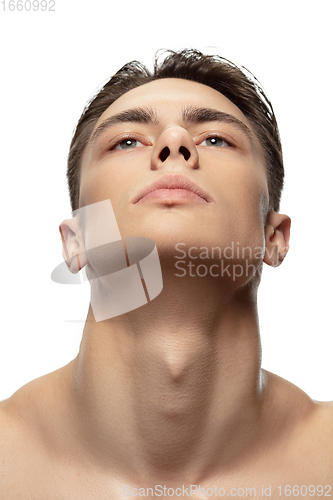 Image of Portrait of young man isolated on white studio background. Caucasian attractive male model. Concept of fashion and beauty, self-care, body and skin care.