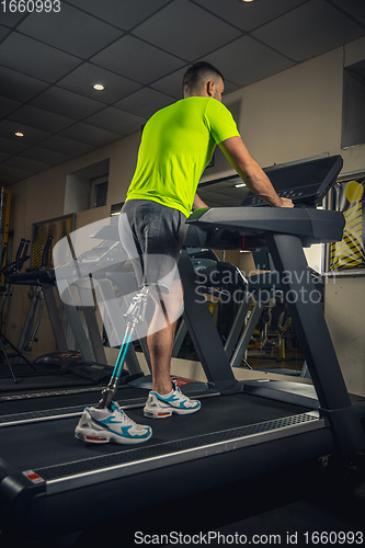 Image of Disabled man training in the gym of rehabilitation center