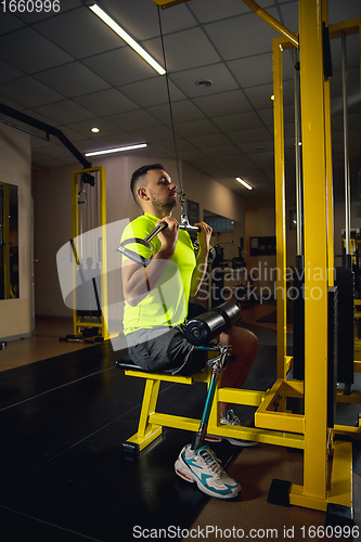 Image of Disabled man training in the gym of rehabilitation center