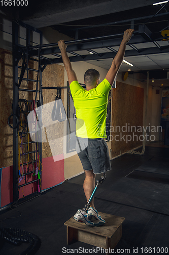 Image of Disabled man training in the gym of rehabilitation center