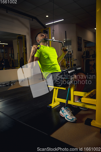 Image of Disabled man training in the gym of rehabilitation center