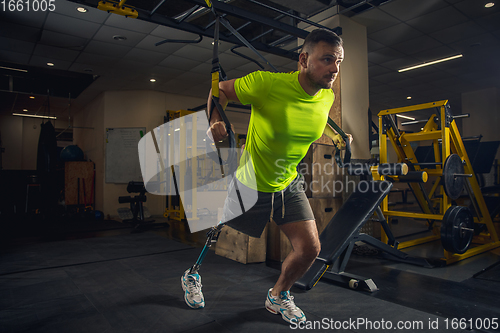 Image of Disabled man training in the gym of rehabilitation center