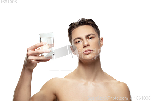Image of Portrait of young man isolated on white studio background. Caucasian attractive male model. Concept of fashion and beauty, self-care, body and skin care.