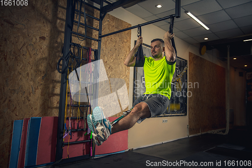 Image of Disabled man training in the gym of rehabilitation center