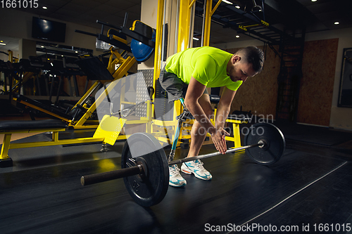 Image of Disabled man training in the gym of rehabilitation center