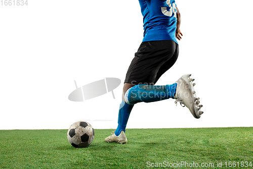 Image of Close up legs of professional soccer, football player fighting for ball on field isolated on white background