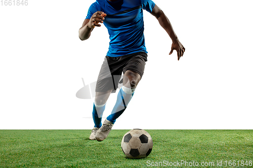 Image of Close up legs of professional soccer, football player fighting for ball on field isolated on white background