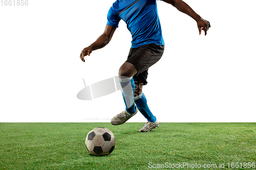 Image of Close up legs of professional soccer, football player fighting for ball on field isolated on white background