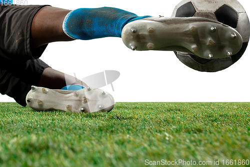 Image of Close up legs of professional soccer, football player fighting for ball on field isolated on white background