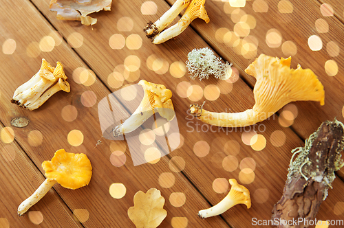 Image of chanterelles on wooden background