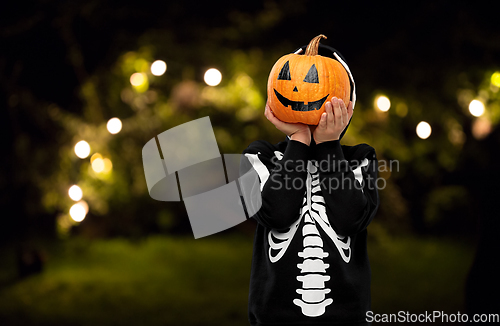 Image of boy in halloween costume with jack-o-lantern