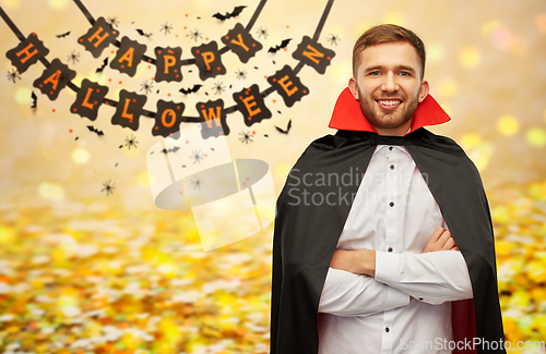 Image of happy man in halloween costume of vampire