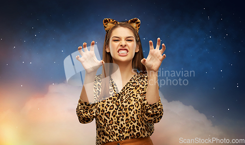 Image of happy woman in halloween costume of leopard