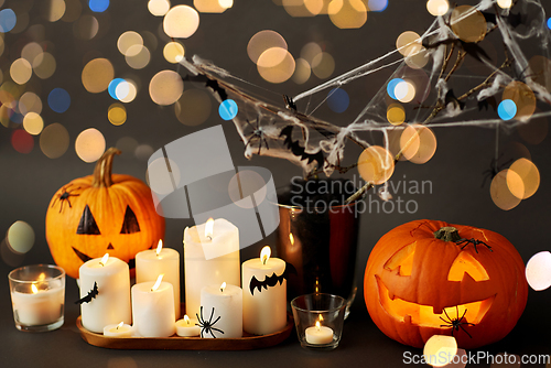 Image of pumpkins, candles and halloween decorations