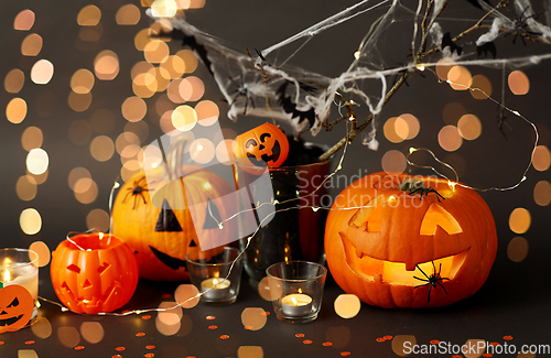 Image of pumpkins, candles and halloween decorations